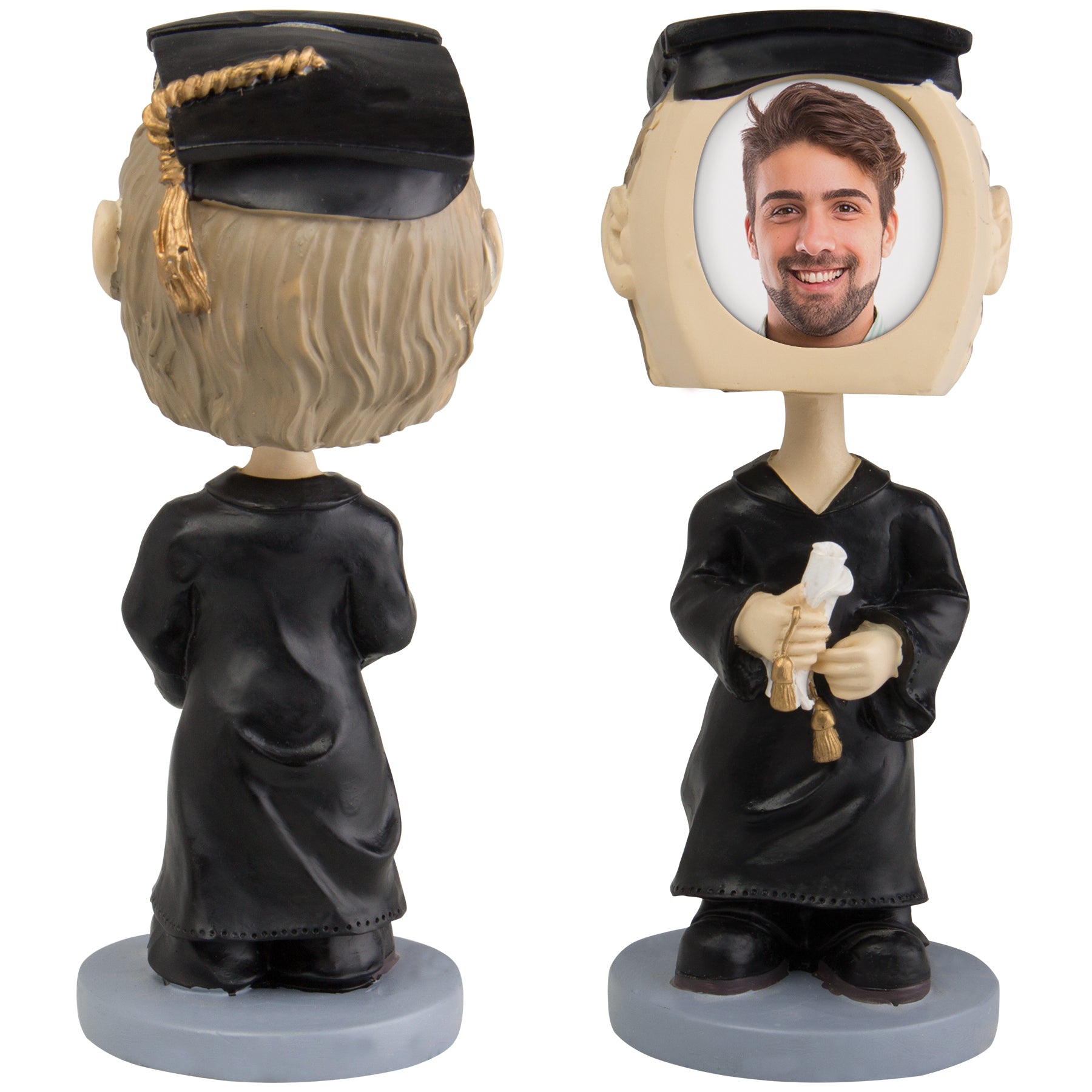 A photo bobble head display featuring a figure in a graduation gown and cap, holding a diploma, with a slot on the top for inserting a photo.