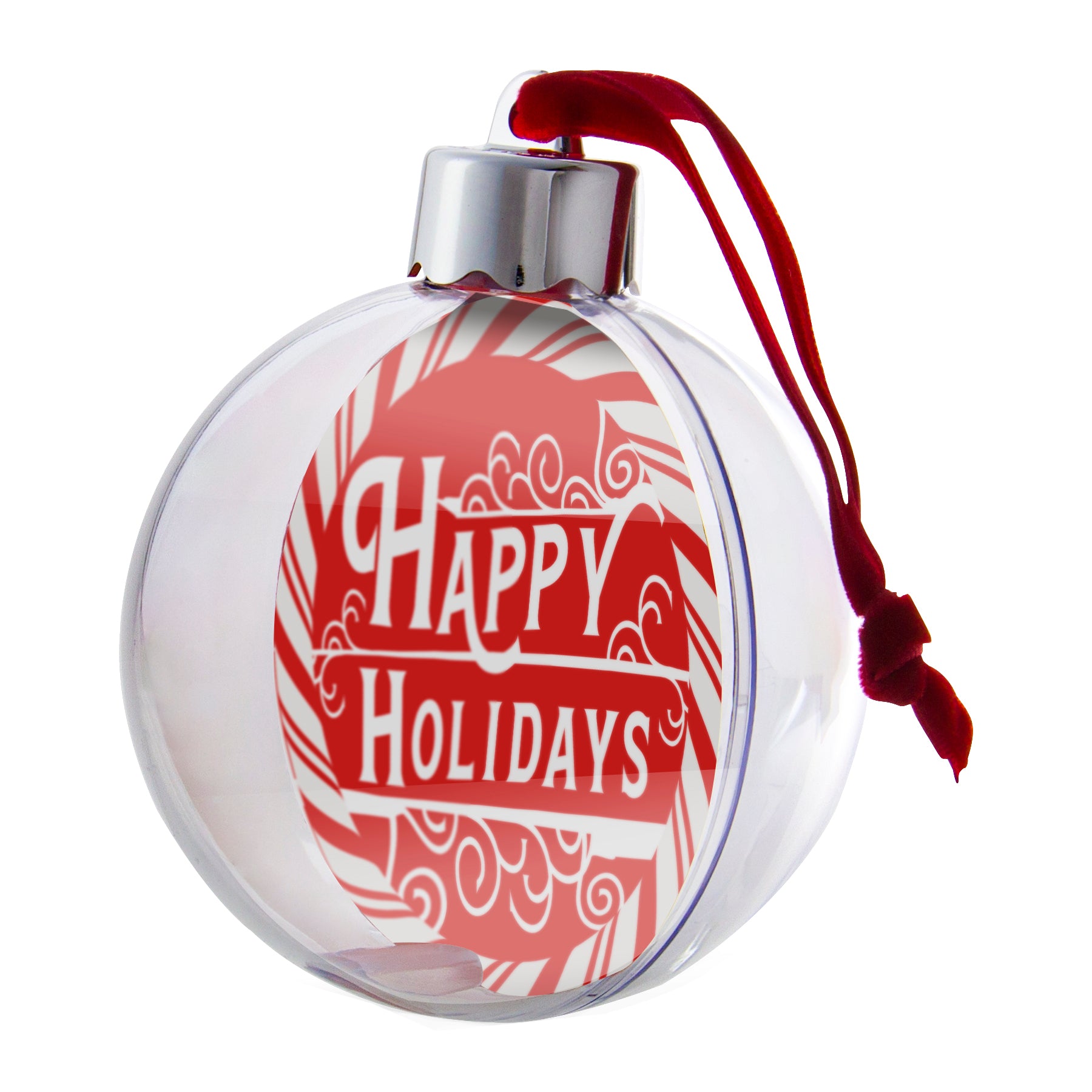 A clear, round Christmas ornament with  a red velvet hanger ribbon, showcased on an angle displayed on a white background.