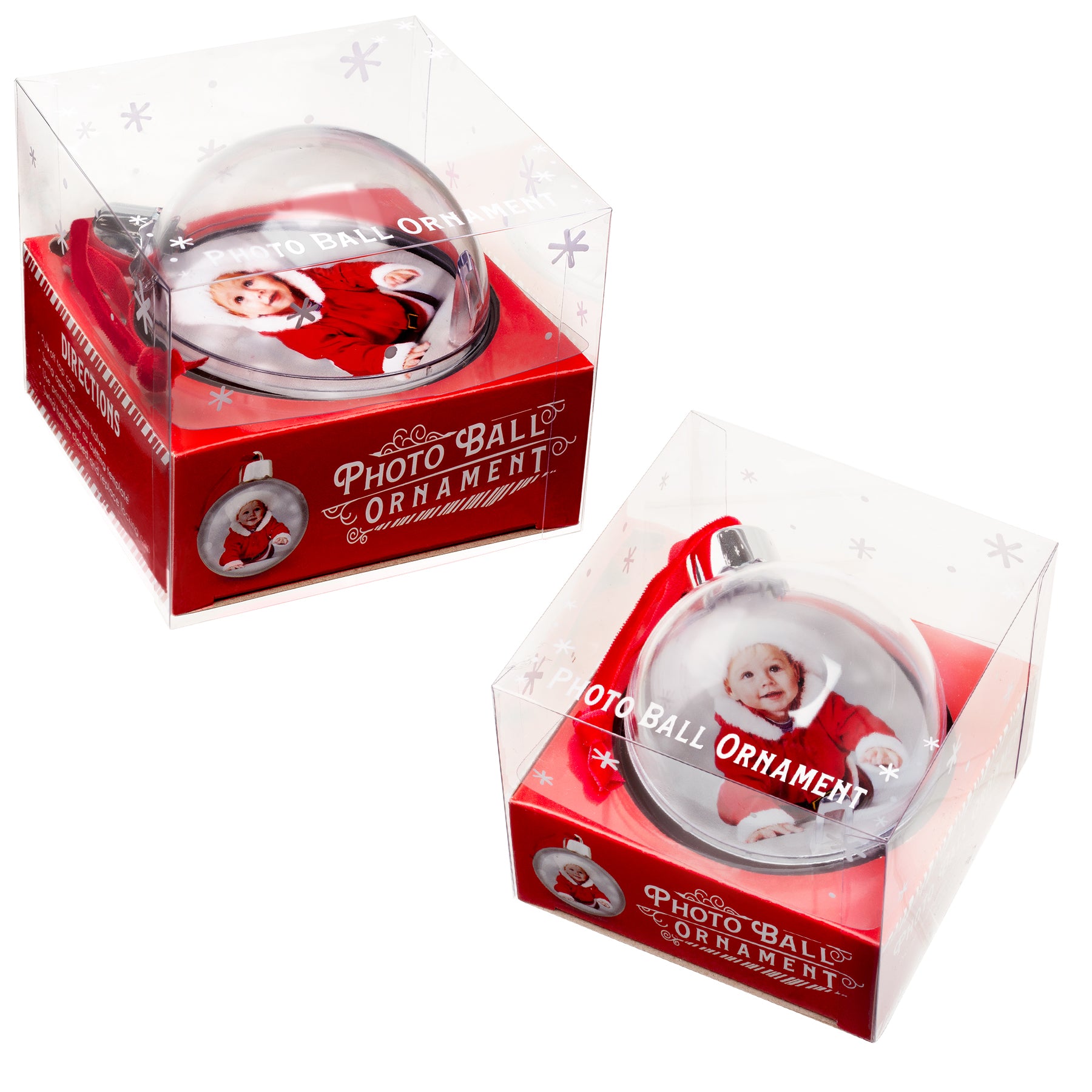 Two clear, round Christmas ornaments in full-color retail packaging.