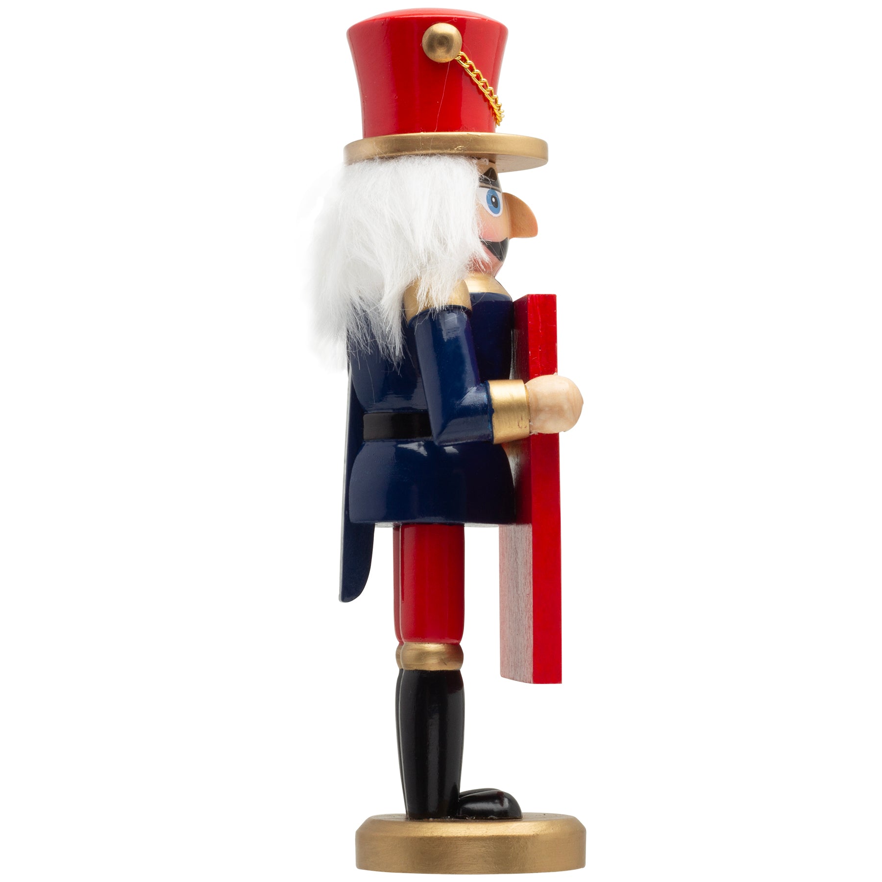 A sideways view of a hand-painted mini photo nutcracker with a gold base, dressed in a navy blue coat with gold accents, red pants, and black boots, holding a photo frame.