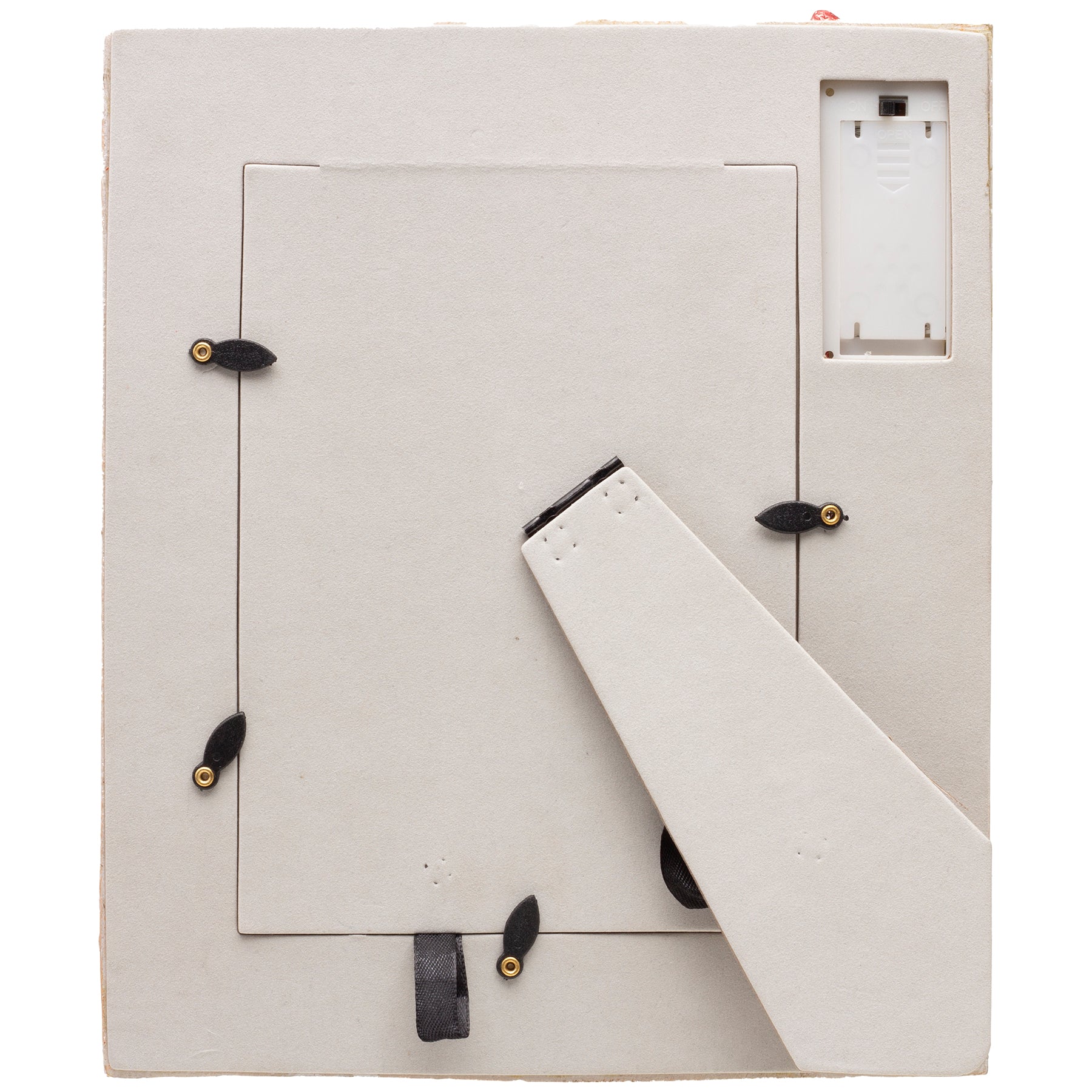 The back of a festive Santa's Workshop resin picture frame with an easel for tabletop display.