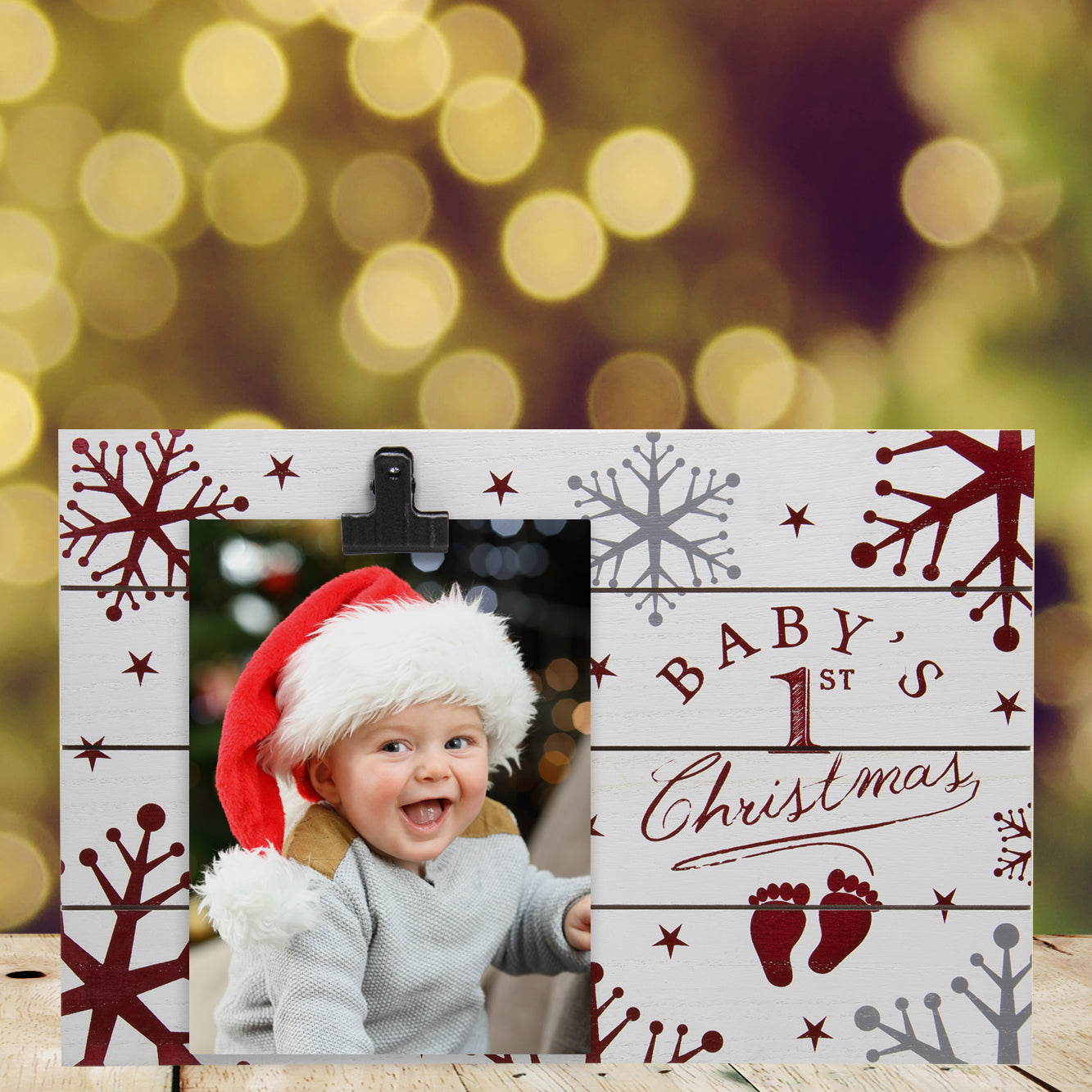 A wooden clipboard picture frame with a Christmas theme, featuring the text 'Baby's 1st Christmas' decorated with snowflakes and stars on a festive holiday background.