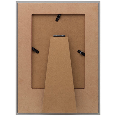 The back side of a wooden picture frame showing a wooden easel for tabletop display.