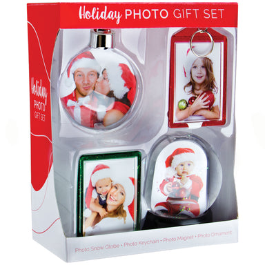 A packaged holiday photo gift set containing a photo ornament ball, snap-in photo keychain, snap-in picture frame magnet, and a mini photo snow globe, each featuring a slot to insert photos.