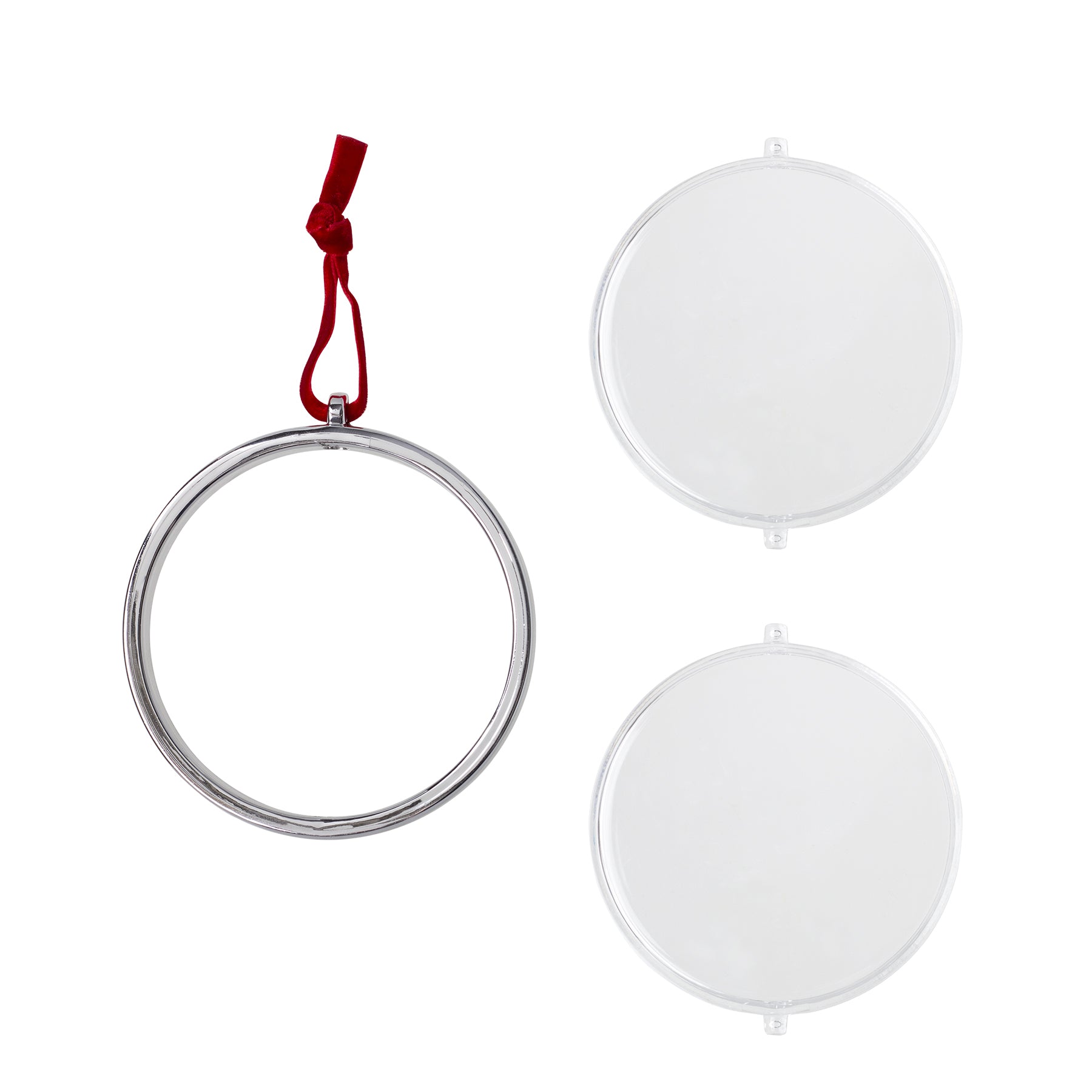 A silver circle with red velvet string, and two circle plastic pieces that create one photo ornament.