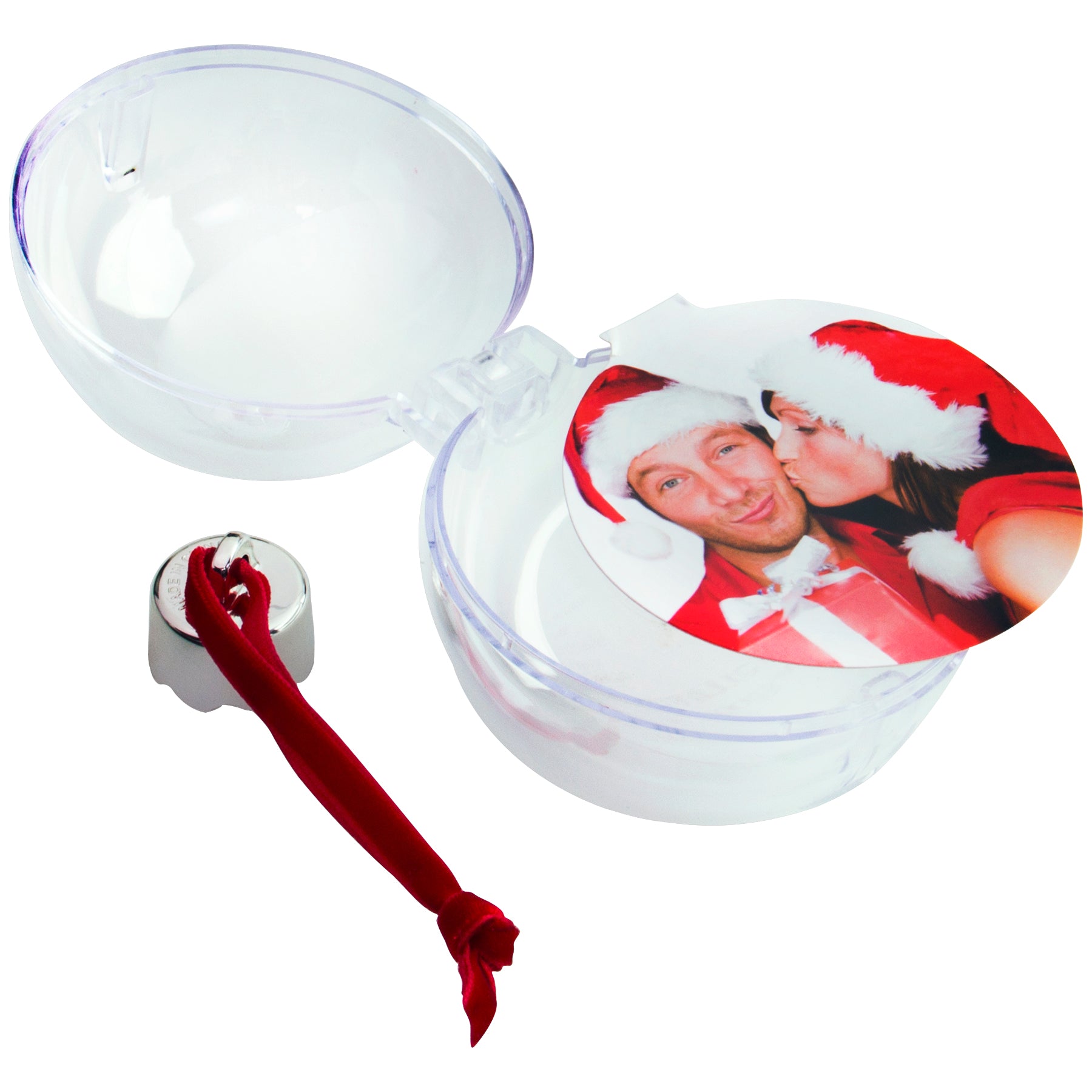 A clear, round Christmas ornament opened down the center showcasing how to insert an image into the photo ornament, as well as a silver cap and a red velvet ribbon displayed on a white background.