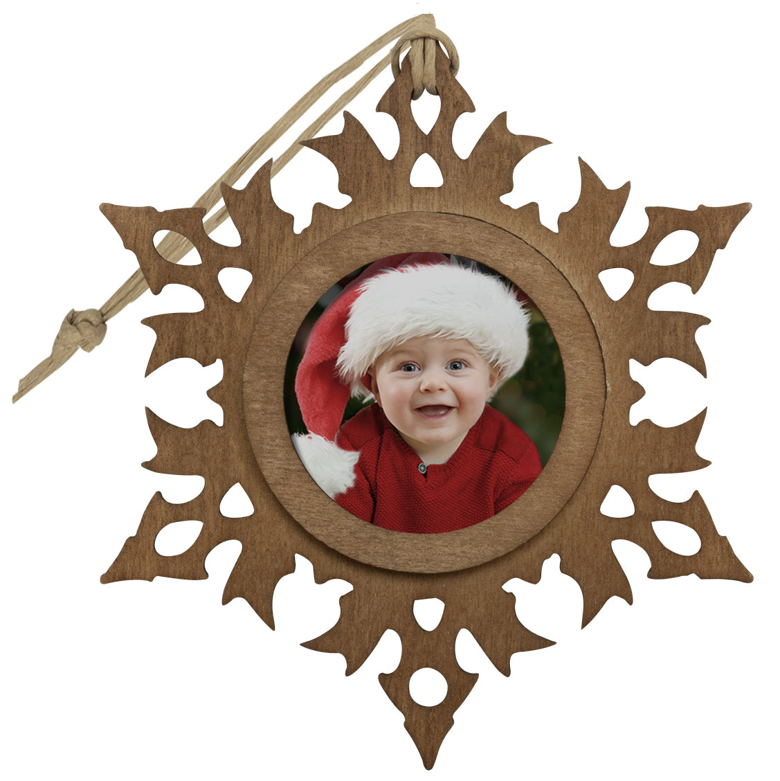 A wooden snowflake-shaped photo ornament with a photo of a smiling child in the center, displayed against a white background.