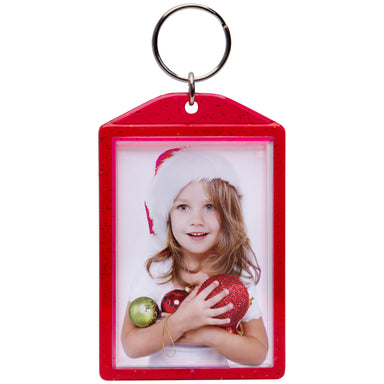 A red snap-in photo keychain displayed on a white background.