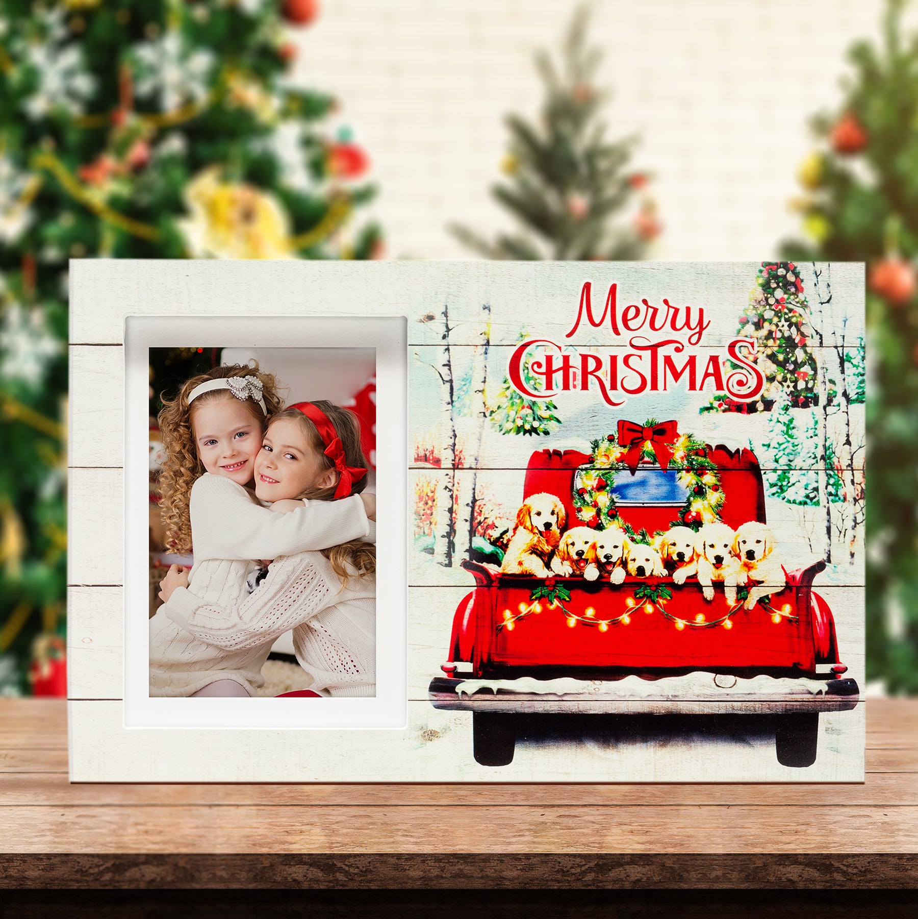 A wooden picture frame with a rustic design, featuring the back of a red truck filled with golden retriever puppies, surrounded by a Christmas-themed scene with trees and decorations on a festive lifestyle background.