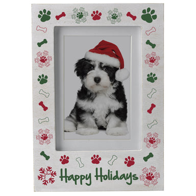 A white wooden pet picture frame with the phrase "Happy Holidays" at the bottom with a border of red and green paw prints, bones, and snowflakes on a white background.