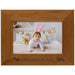 Wooden photo frame with a child wearing bunny ears and the text 'Snuggle Bunny'.