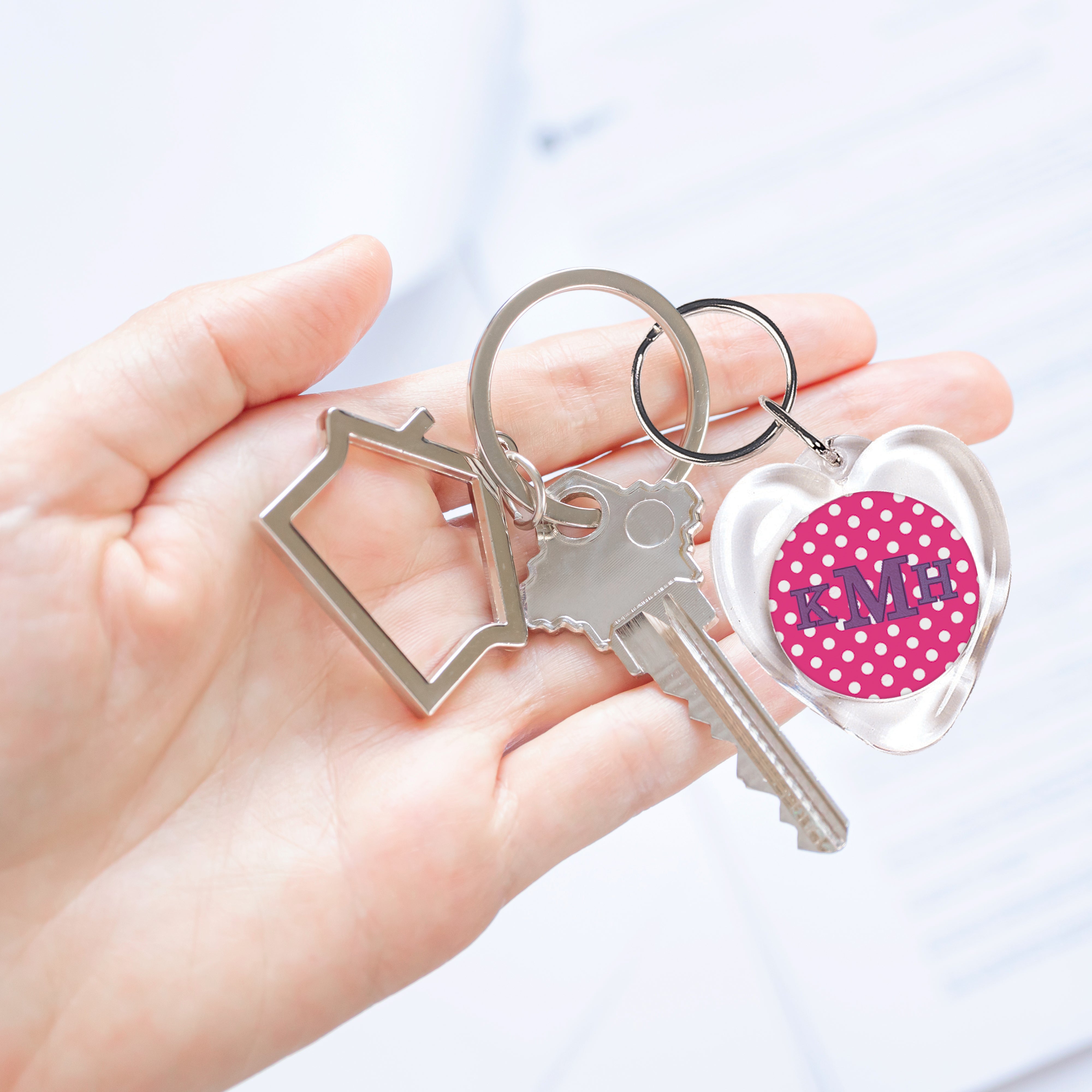 A personalized custom heart photo keychain used by etsy sellers and crafters for keys.