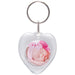 A heart-shaped clear plastic keychain with a snap-in photo of a baby.